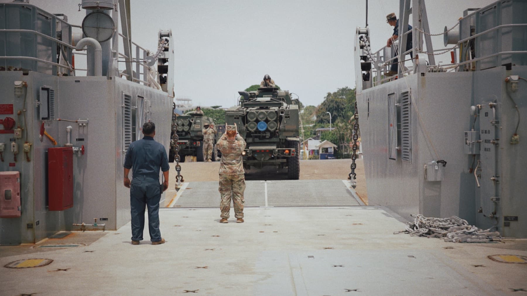 Vehicle and crew aboard an Army landing craft