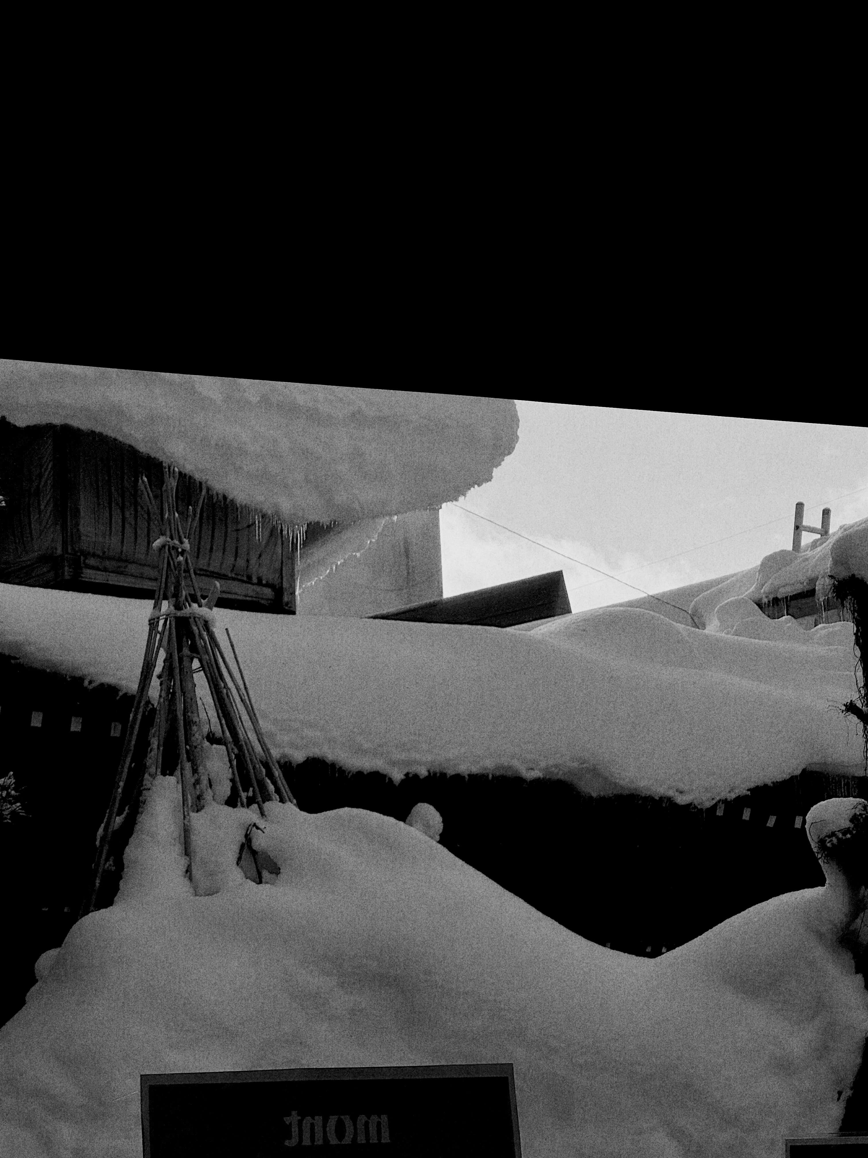 Snow piled on a village roof