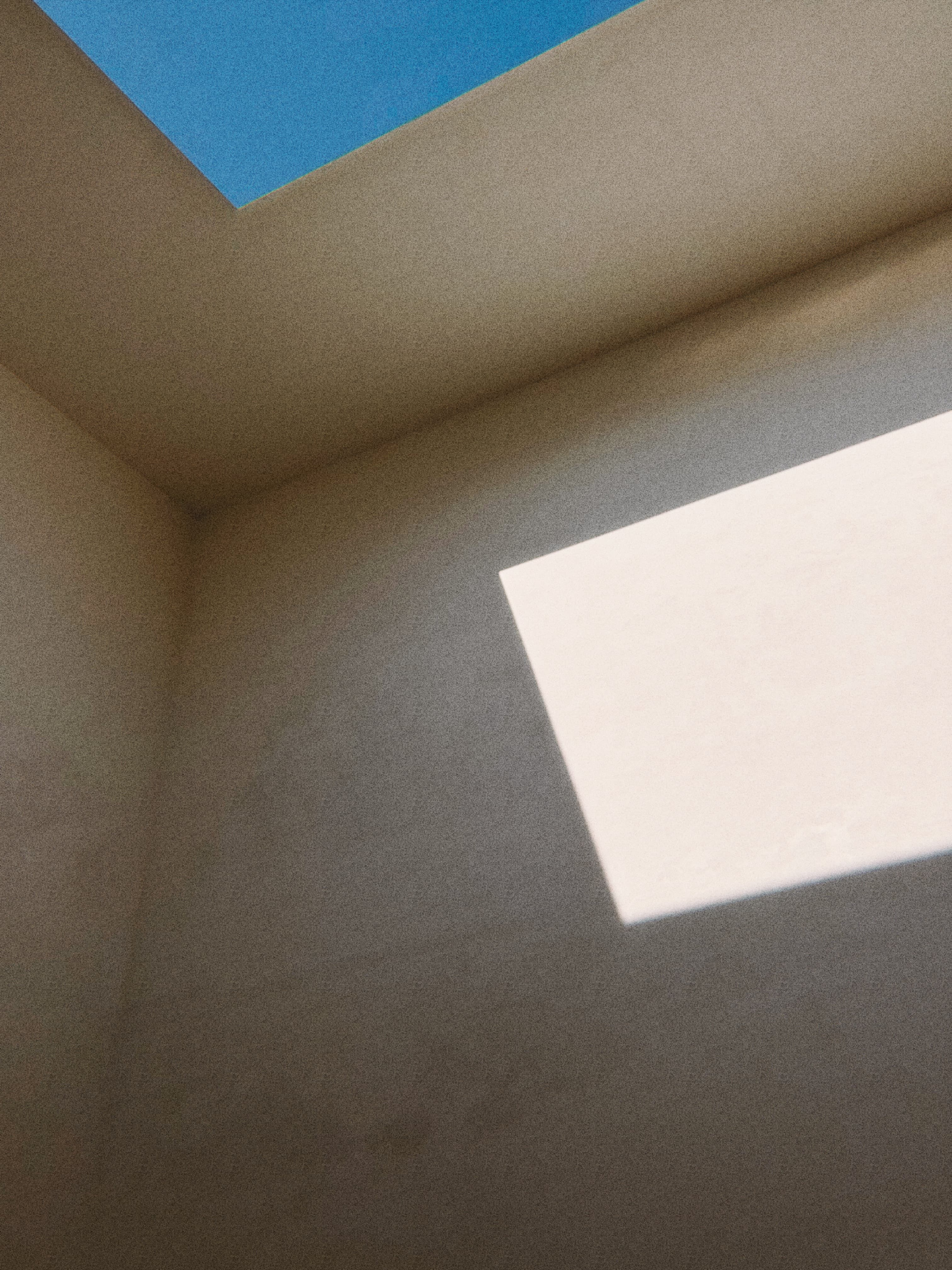 Abstract sunlight across a concrete wall